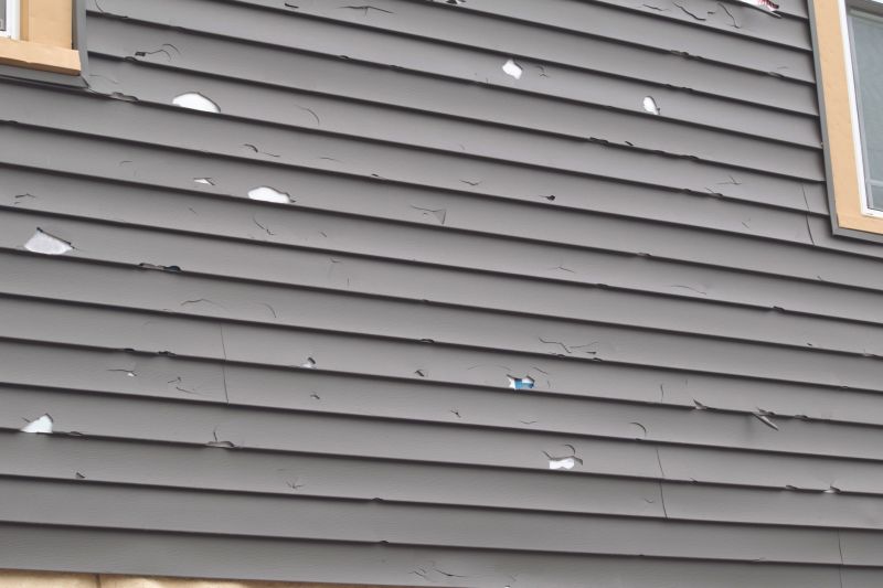 Vinyl Siding Repair - Close-up of Damage
